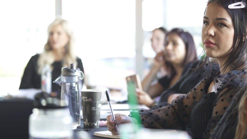 students listening during training